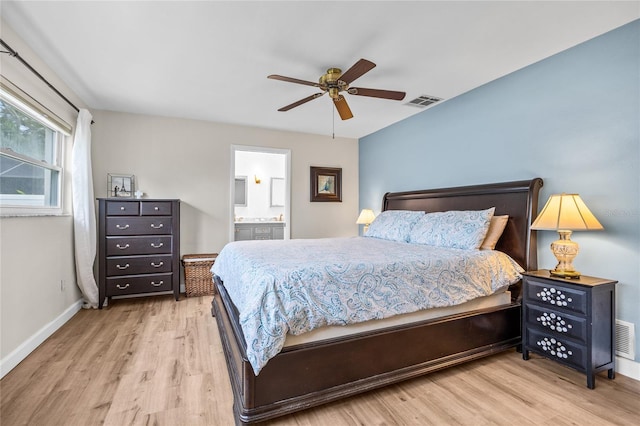 1251 Fairway Dr, Dunedin, FL 34698 - bedroom featuring wood finished floors, connected bathroom, and ceiling fan