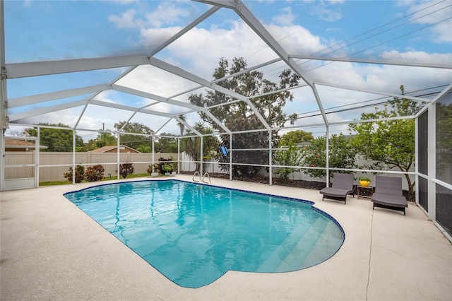 1251 Fairway Dr, Dunedin, FL 34698 - view of swimming pool with a fenced backyard, a patio area, and glass enclosure