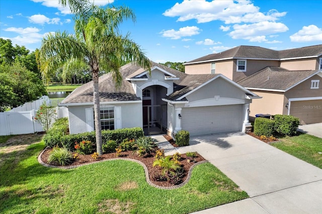 11309 Langworth Hill Ln, Riverview, FL 33579 - view of front of property with stucco siding, a garage, concrete driveway, and roof with shingles