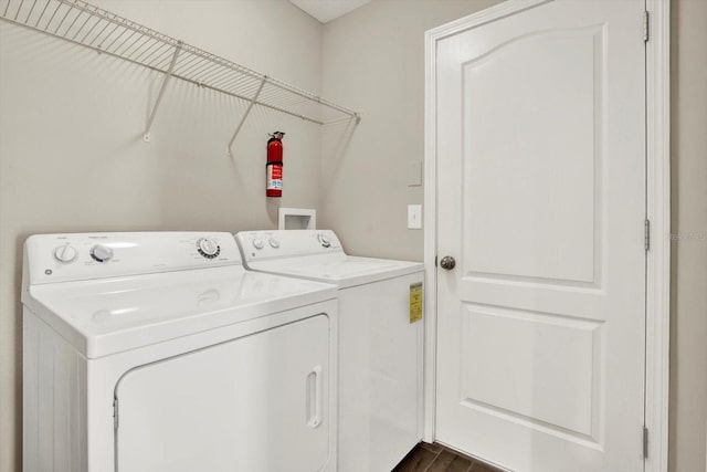 11309 Langworth Hill Ln, Riverview, FL 33579 - washroom with independent washer and dryer and dark wood-style flooring