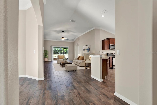 11309 Langworth Hill Ln, Riverview, FL 33579 - living area featuring dark wood-style floors, crown molding, ceiling fan, lofted ceiling, and recessed lighting