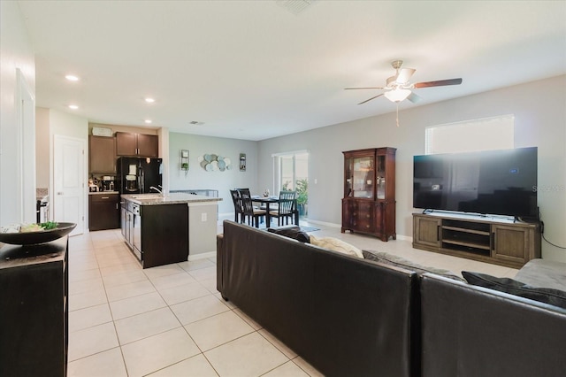 17156 Yellow Pine St, Wimauma, FL 33598 - living room featuring a ceiling fan, light tile patterned floors, and recessed lighting