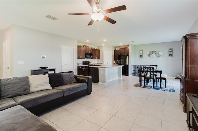 17156 Yellow Pine St, Wimauma, FL 33598 - living room with ceiling fan, light tile patterned flooring, and recessed lighting