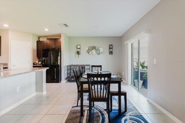 17156 Yellow Pine St, Wimauma, FL 33598 - dining room featuring light tile patterned floors and recessed lighting