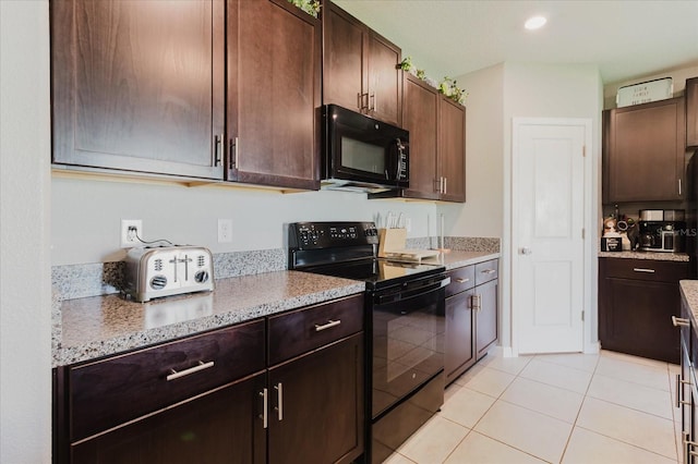 17156 Yellow Pine St, Wimauma, FL 33598 - kitchen featuring black appliances, light tile patterned flooring, dark brown cabinetry, and light stone countertops