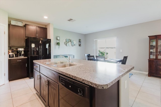 17156 Yellow Pine St, Wimauma, FL 33598 - kitchen with black appliances, light tile patterned floors, a kitchen island with sink, light countertops, and recessed lighting