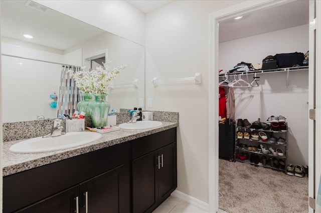 17156 Yellow Pine St, Wimauma, FL 33598 - full bath with double vanity, a spacious closet, curtained shower, and recessed lighting
