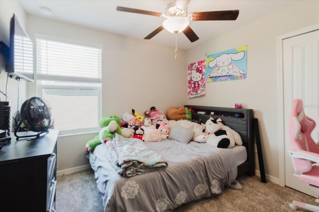 17156 Yellow Pine St, Wimauma, FL 33598 - carpeted bedroom with baseboards and a ceiling fan