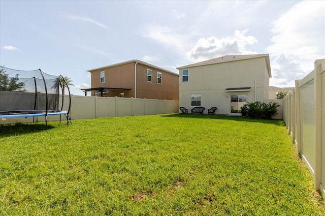 17156 Yellow Pine St, Wimauma, FL 33598 - fenced backyard with a trampoline