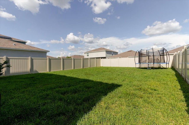 17156 Yellow Pine St, Wimauma, FL 33598 - fenced backyard with a trampoline
