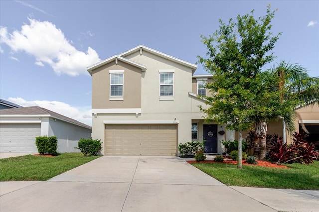 17156 Yellow Pine St, Wimauma, FL 33598 - view of front of home with concrete driveway, stucco siding, and an attached garage