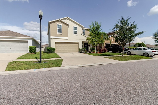 17156 Yellow Pine St, Wimauma, FL 33598 - view of front of home featuring driveway, stucco siding, a front yard, and a garage