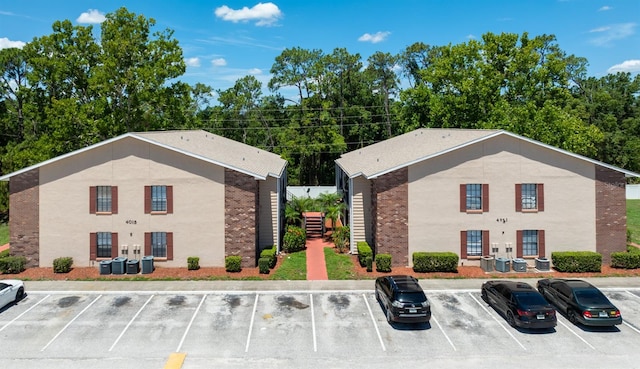 4015 My Lady Ln Unit 7, Land O Lakes, FL 34638 - view of property featuring uncovered parking