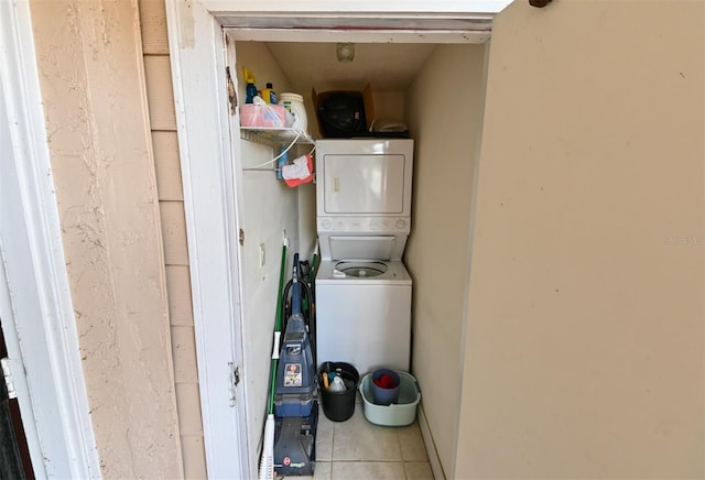 4015 My Lady Ln Unit 7, Land O Lakes, FL 34638 - laundry area with stacked washer / drying machine and tile patterned floors