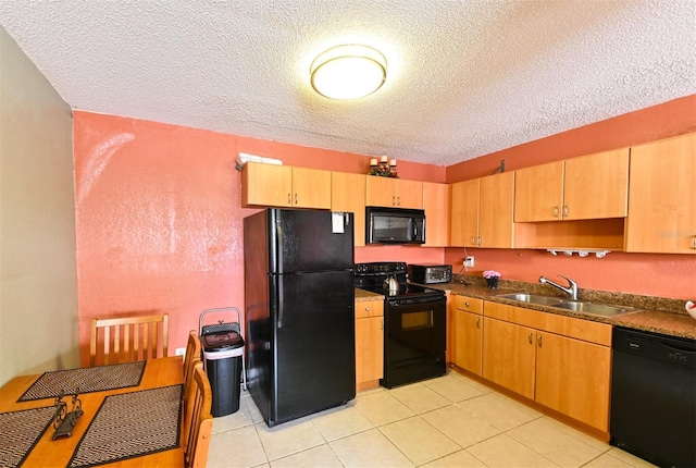4015 My Lady Ln Unit 7, Land O Lakes, FL 34638 - kitchen with black appliances, a textured ceiling, dark countertops, and light tile patterned floors
