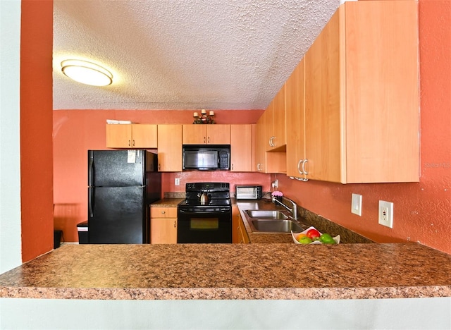 4015 My Lady Ln Unit 7, Land O Lakes, FL 34638 - kitchen featuring black appliances, light brown cabinetry, a textured ceiling, and a peninsula