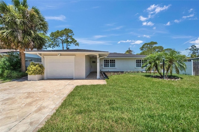 4518 Helena St NE, Saint Petersburg, FL 33703 - ranch-style house with stucco siding, a garage, and driveway