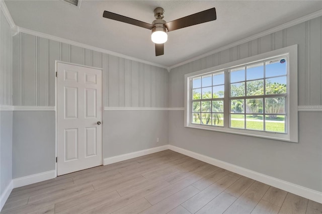 4518 Helena St NE, Saint Petersburg, FL 33703 - unfurnished room featuring ornamental molding, light wood-type flooring, and a ceiling fan