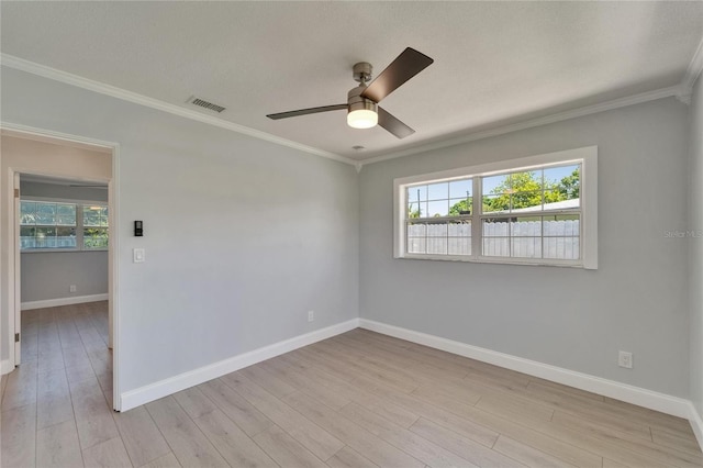 4518 Helena St NE, Saint Petersburg, FL 33703 - unfurnished room with healthy amount of natural light, a ceiling fan, crown molding, and light wood-type flooring