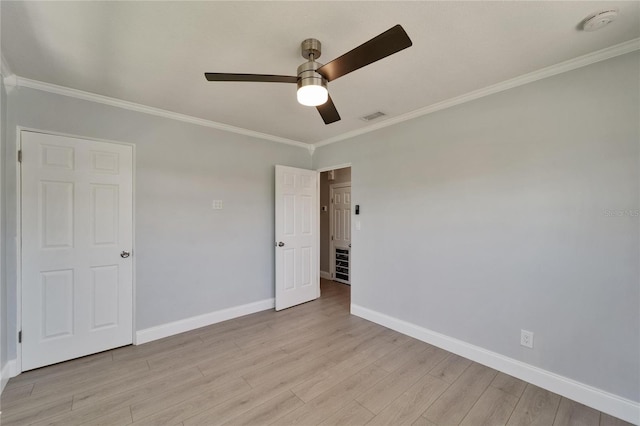4518 Helena St NE, Saint Petersburg, FL 33703 - unfurnished bedroom featuring crown molding, light wood-type flooring, and ceiling fan