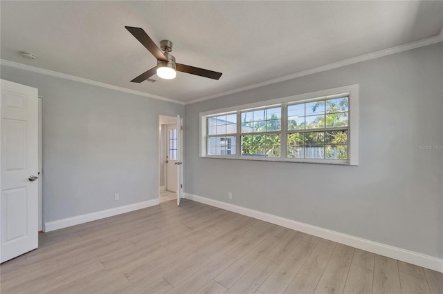 4518 Helena St NE, Saint Petersburg, FL 33703 - spare room featuring ceiling fan, light wood finished floors, crown molding, and a smoke detector