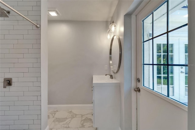 4518 Helena St NE, Saint Petersburg, FL 33703 - bathroom featuring marble finish floors, vanity, and tiled shower