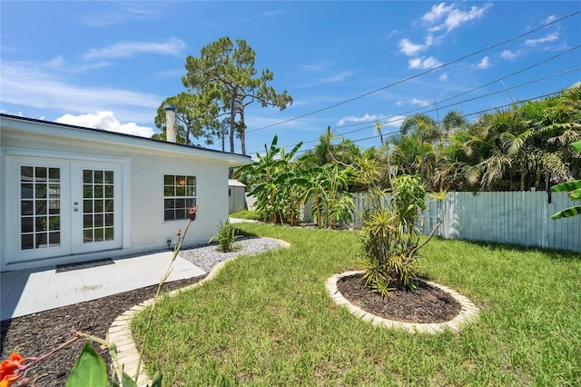 4518 Helena St NE, Saint Petersburg, FL 33703 - fenced backyard with french doors and a patio