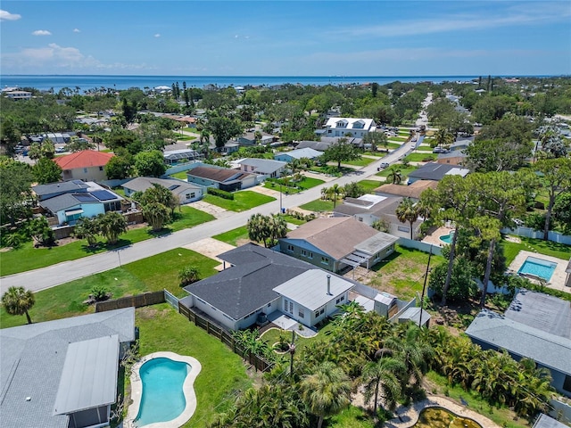 4518 Helena St NE, Saint Petersburg, FL 33703 - aerial perspective of suburban area featuring a pool and a large body of water