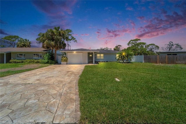 4518 Helena St NE, Saint Petersburg, FL 33703 - ranch-style house with concrete driveway, an attached garage, and stucco siding