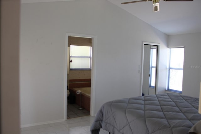 5581 Greyston St, Palm Harbor, FL 34685 - bedroom with vaulted ceiling, ensuite bath, and a ceiling fan