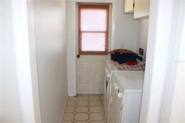 5581 Greyston St, Palm Harbor, FL 34685 - laundry area with washer and clothes dryer and cabinet space