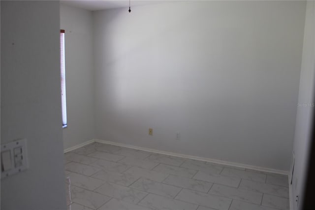 5581 Greyston St, Palm Harbor, FL 34685 - unfurnished room featuring light marble finish floors and healthy amount of natural light