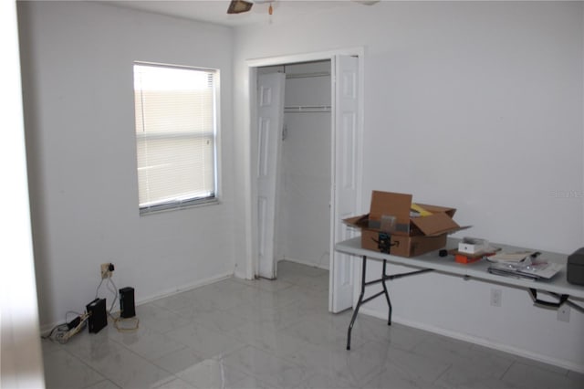 5581 Greyston St, Palm Harbor, FL 34685 - unfurnished office with a ceiling fan and light marble finish flooring