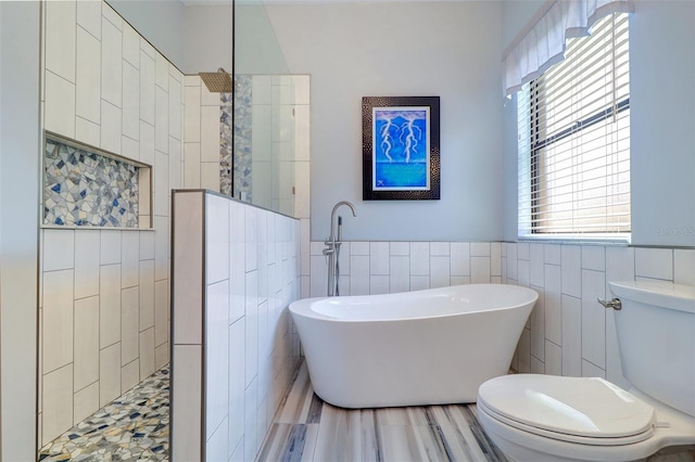 3704 Darston St, Palm Harbor, FL 34685 - full bath with tile walls, a soaking tub, walk in shower, and wainscoting