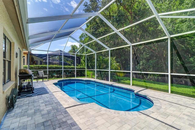 3704 Darston St, Palm Harbor, FL 34685 - outdoor pool featuring a patio, a grill, and a lanai