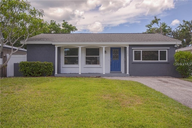 1882 Maryland Ave NE, Saint Petersburg, FL 33703 - ranch-style house featuring a front lawn, stucco siding, and a porch