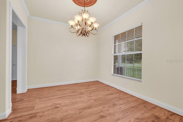 10510 Lithia Estates Dr, Lithia, FL 33547 - empty room featuring ornamental molding, a chandelier, and light wood-style floors