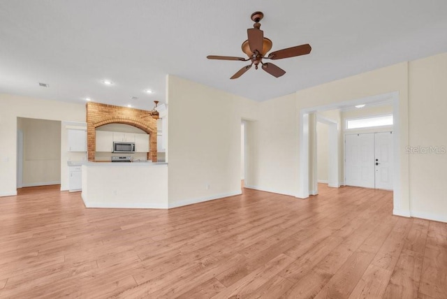 10510 Lithia Estates Dr, Lithia, FL 33547 - unfurnished living room with a ceiling fan, light wood-style flooring, and recessed lighting