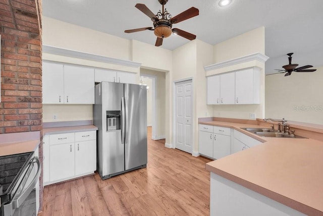 10510 Lithia Estates Dr, Lithia, FL 33547 - kitchen with stainless steel appliances, a ceiling fan, light wood-style floors, light countertops, and recessed lighting