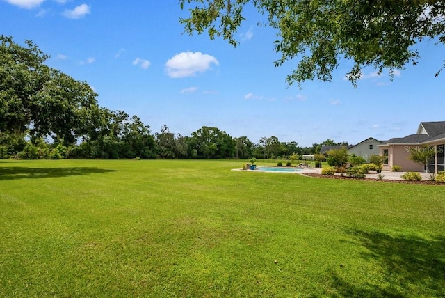 10510 Lithia Estates Dr, Lithia, FL 33547 - view of grassy yard with an outdoor pool
