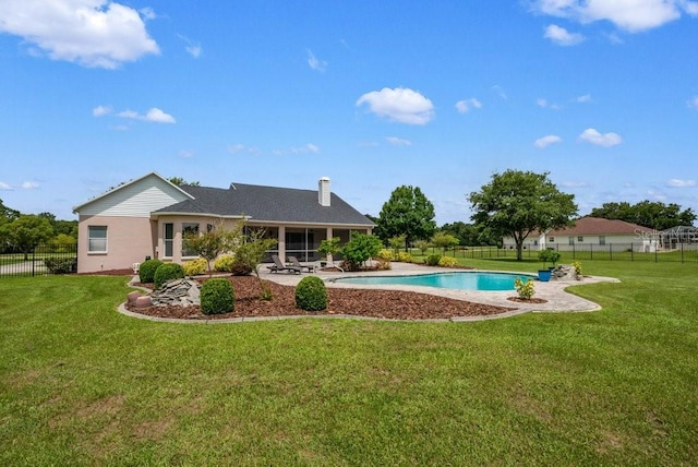 10510 Lithia Estates Dr, Lithia, FL 33547 - rear view of property featuring a fenced backyard, a sunroom, and a chimney