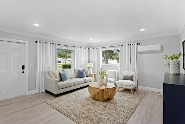 4300 Maple St NE, Saint Petersburg, FL 33703 - living area with a wall mounted air conditioner, light wood-style floors, and recessed lighting