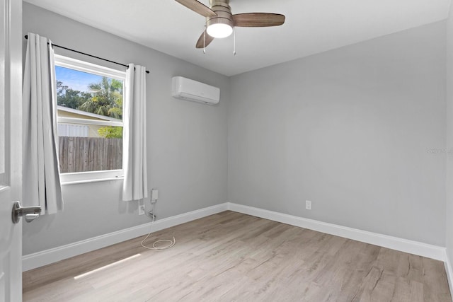 4300 Maple St NE, Saint Petersburg, FL 33703 - empty room featuring an AC wall unit, wood finished floors, and ceiling fan