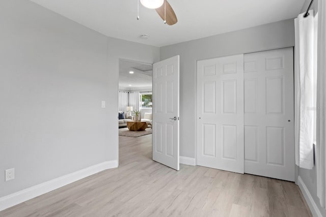 4300 Maple St NE, Saint Petersburg, FL 33703 - unfurnished bedroom with wood finished floors, a closet, and ceiling fan