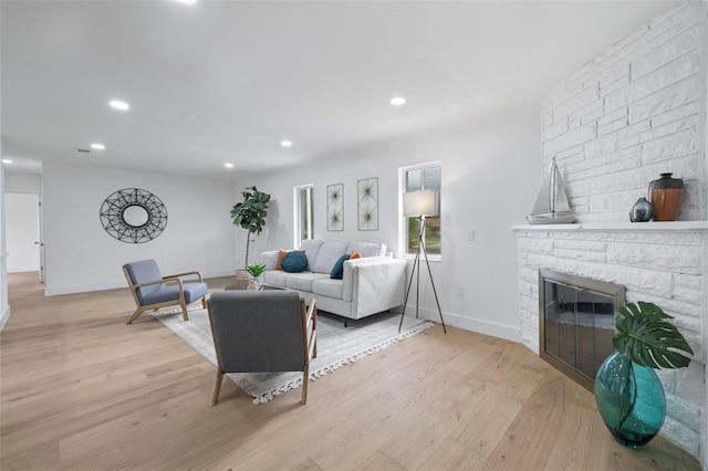 4753 58th St N, Kenneth City, FL 33709 - living area with recessed lighting, light wood-type flooring, and a fireplace