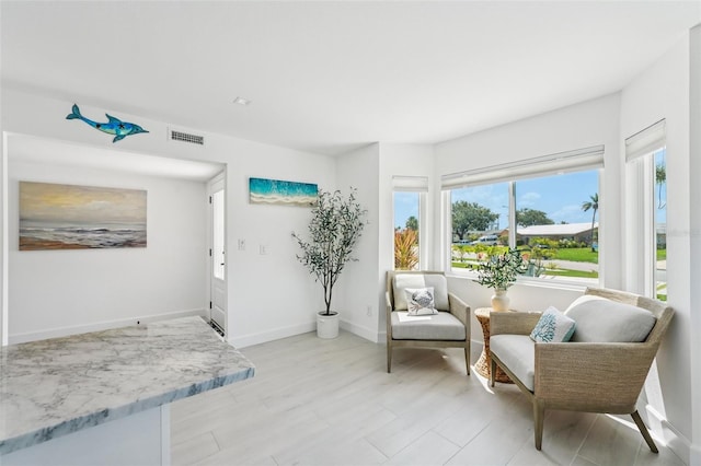311 22nd St, Belleair Beach, FL 33786 - sitting room featuring baseboards