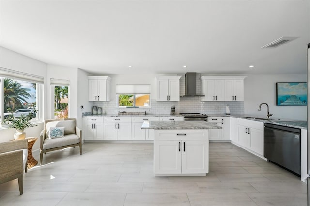 311 22nd St, Belleair Beach, FL 33786 - kitchen with wall chimney exhaust hood, dishwasher, stainless steel range with electric stovetop, decorative backsplash, and recessed lighting