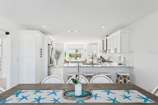 311 22nd St, Belleair Beach, FL 33786 - dining area with recessed lighting