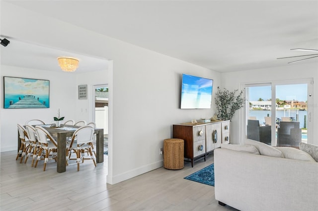 311 22nd St, Belleair Beach, FL 33786 - living area featuring plenty of natural light, light wood-style floors, and a ceiling fan