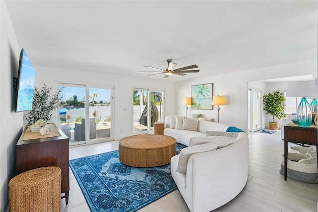 311 22nd St, Belleair Beach, FL 33786 - living area featuring ceiling fan and light wood finished floors